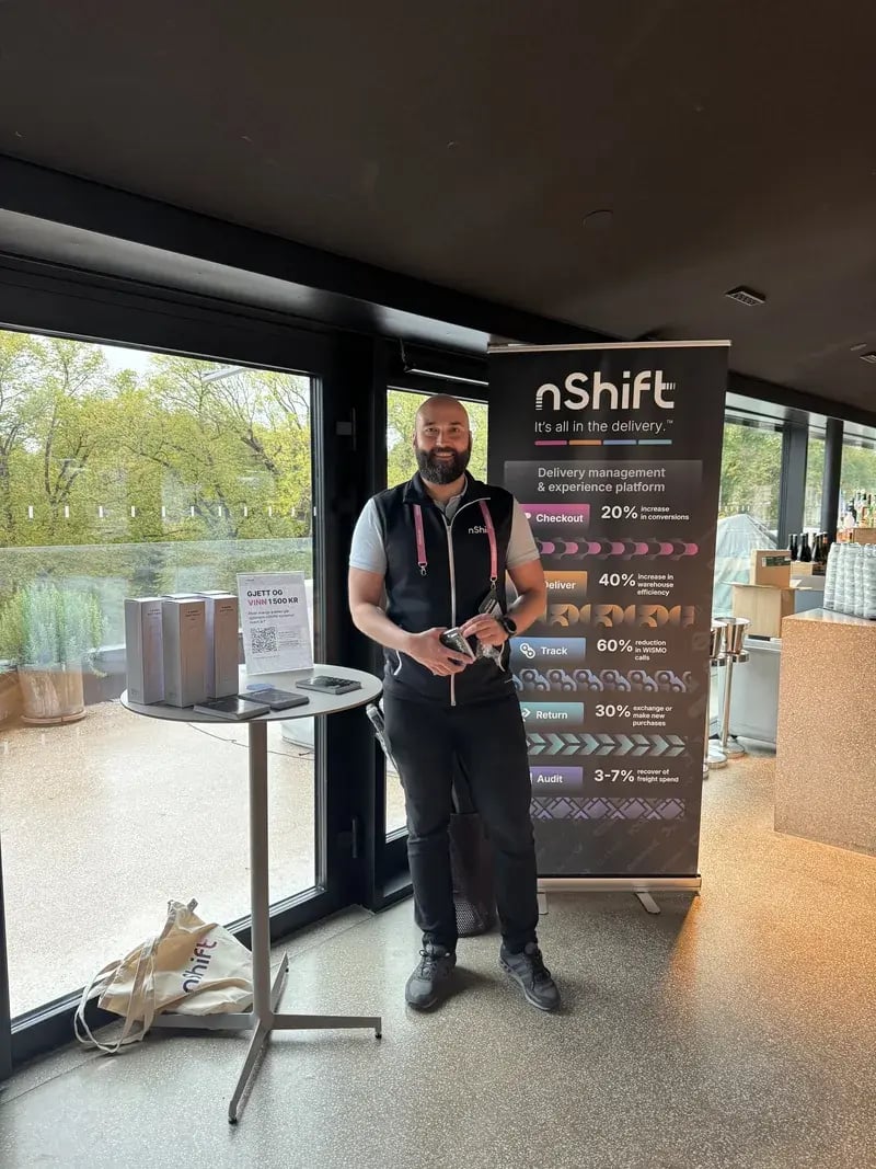 The nShift banner and a member of the nShift team at the Eero rooftop bar during the INSIGHTS by Omnium 2026 afterwork