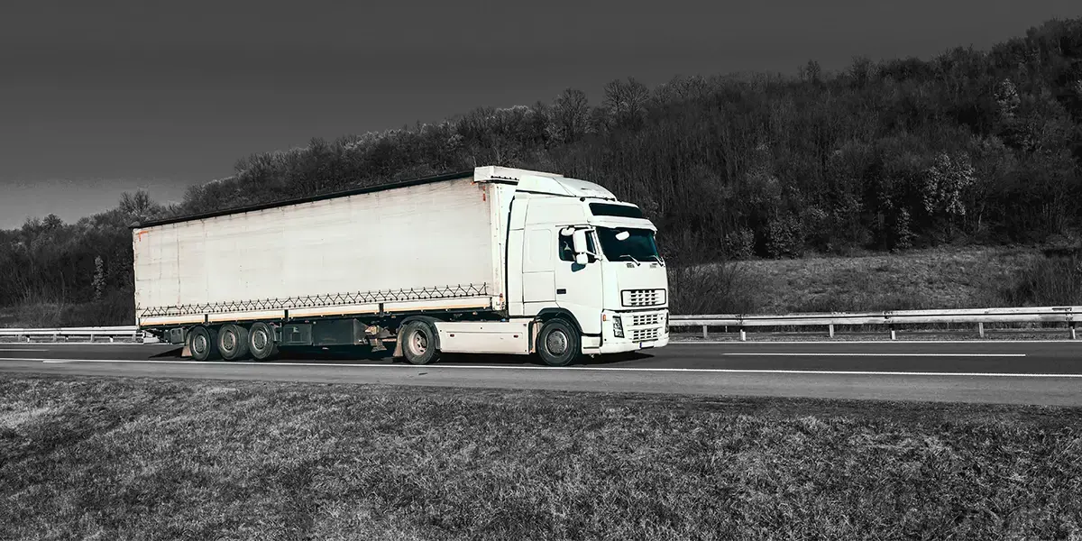 A truck driving through the countryside
