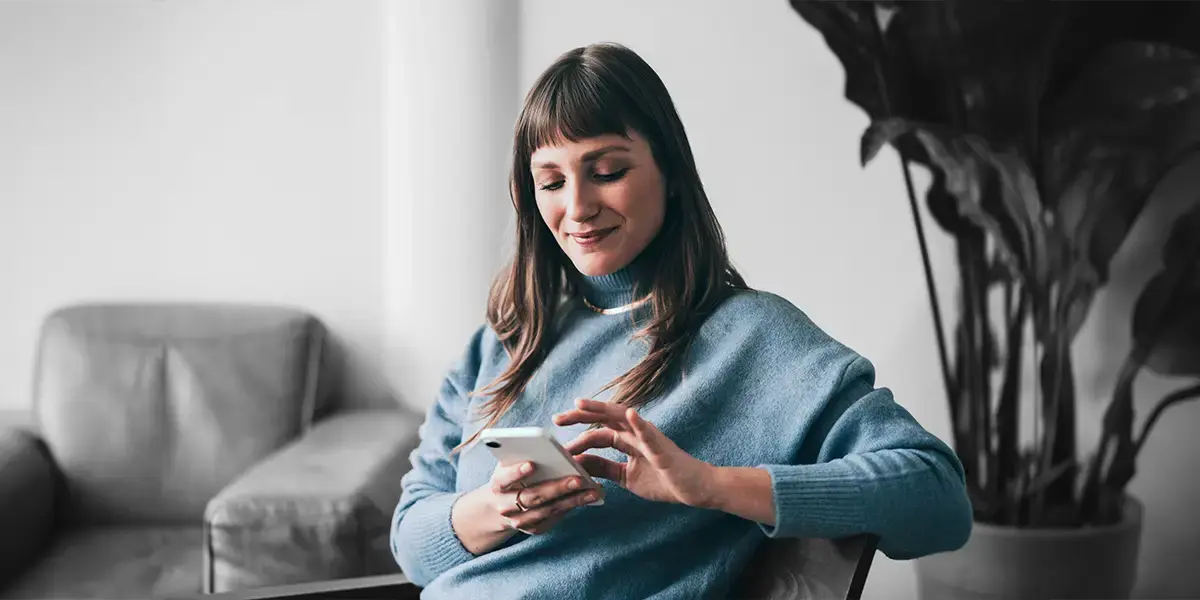 A woman tracking her delivery on her mobile phone